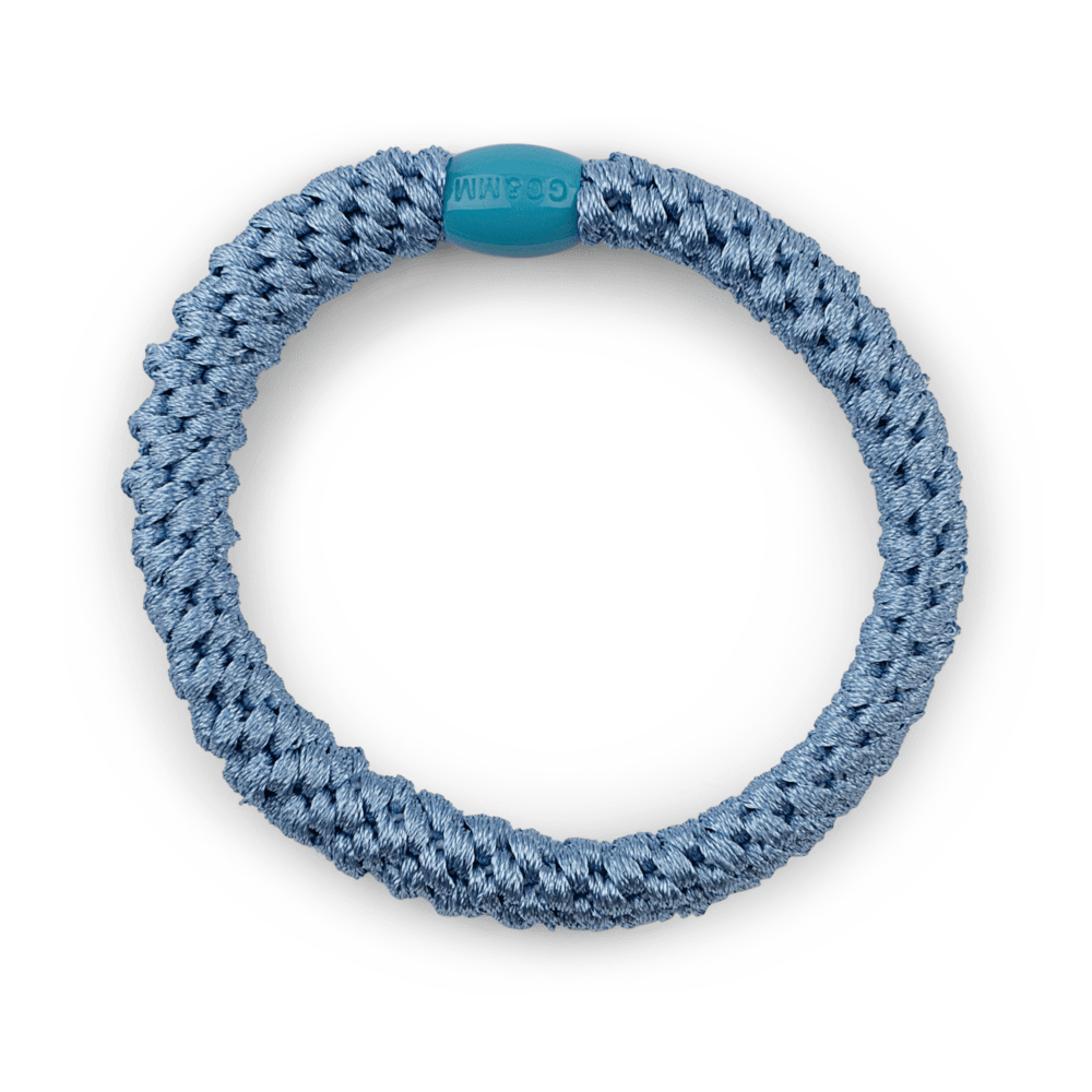 Basic blå hårelastik med vævet tekstur og blødt greb – ideel til daglig brug