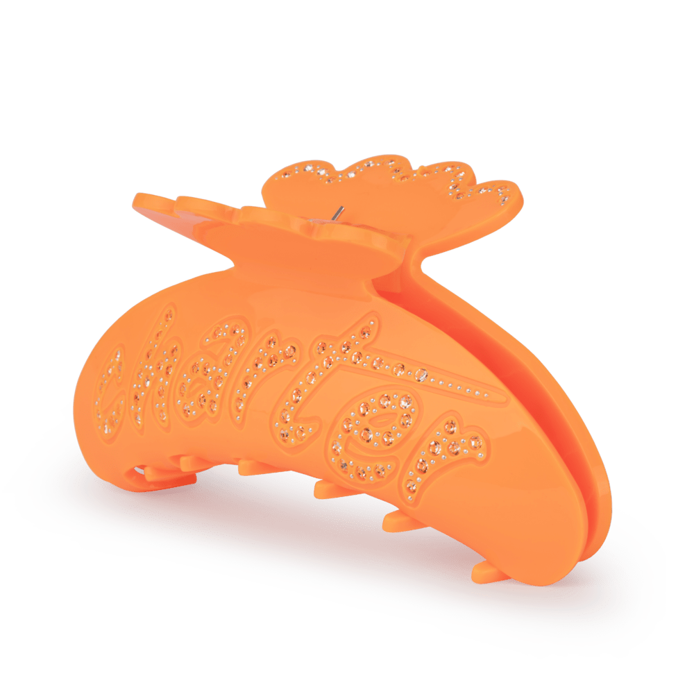 Helle Charter Big hårklemme i orange akryl med glitrende rhinsten og teksten "charter"