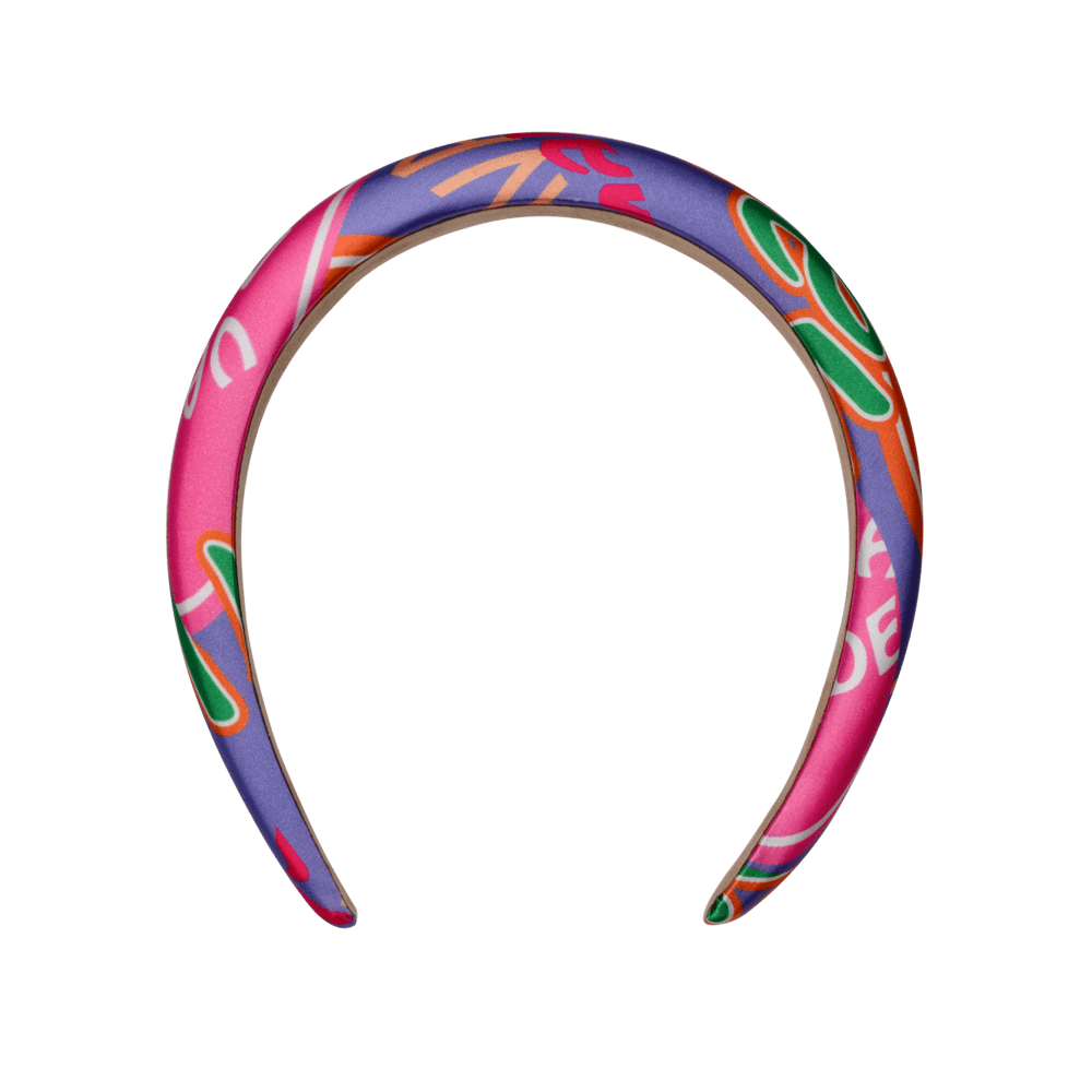 Charter Headband med farverigt, grafisk print i pink, lilla, orange og grøn fra SUI AVA