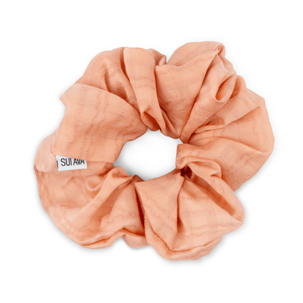 Palma Scrunchie i orange – Blød og let scrunchie, perfekt til hestehaler og knolde.
