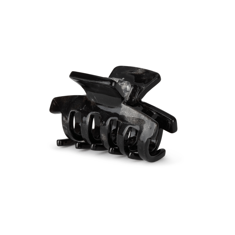 Lea Stardust Mini fra SUI AVA – charmerende mini hårklemme med glitrende stjernedetaljer, perfekt til at tilføje et festligt og elegant touch til dine frisurer.