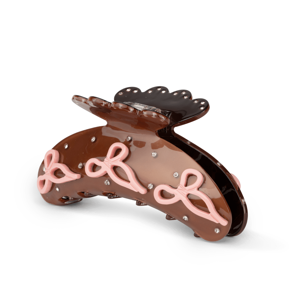 Helle Crystal Bow Big fra SUI AVA – stor hårklemme med elegant sløjfe- og krystaldetalje, ideel til at tilføje et luksuriøst og glamourøst touch til dine frisurer.