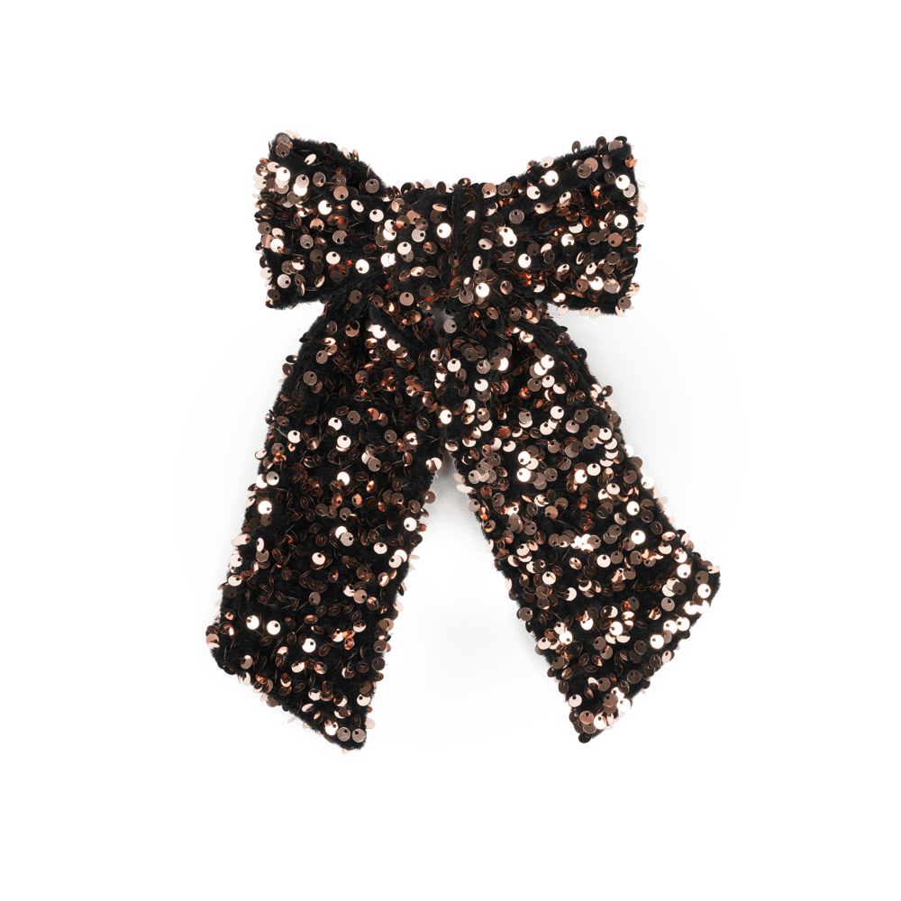 Anne Sequins Bow fra SUI AVA – elegant hårsløjfe med glitrende pailletter, perfekt til at tilføje et festligt og stilfuldt touch til enhver frisure.
