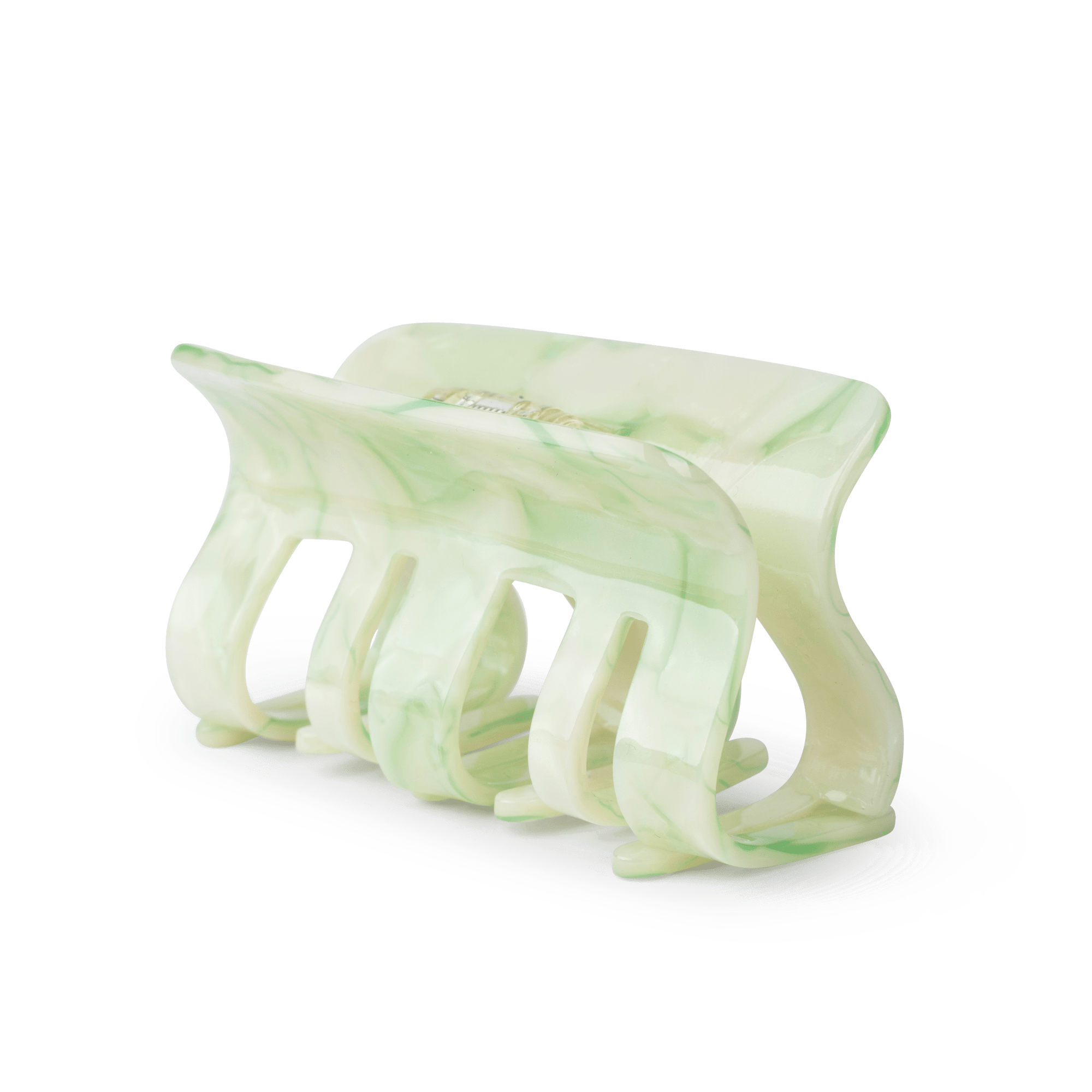 Fie Marble Big fra SUI AVA – stor hårklemme med et smukt lysegrønt marmordesign, ideel til at tilføje et friskt og elegant touch til dine frisurer.