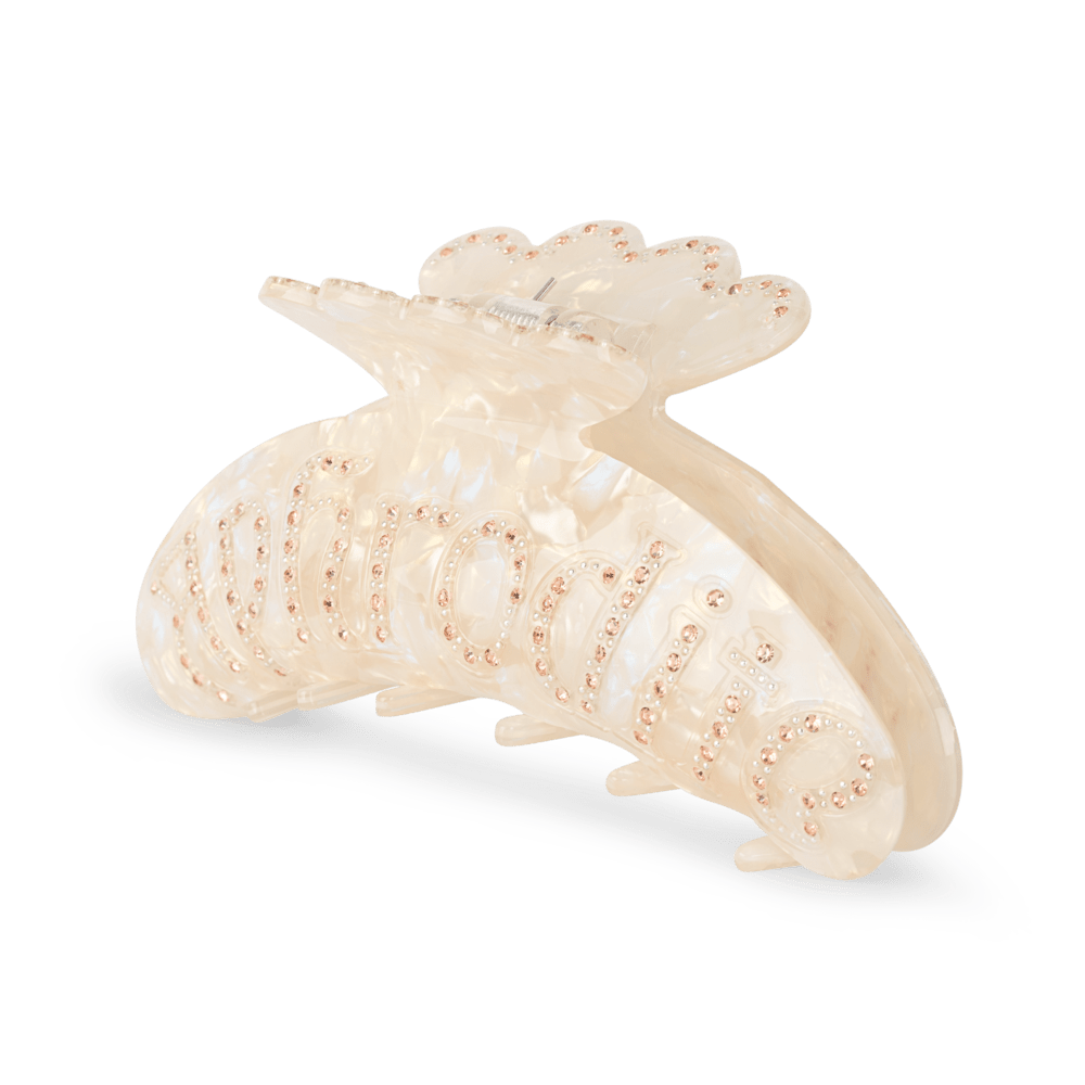 Helle Mother of Pearl Big hårklemme i perlemorshvid med rosa rhinsten og teksten “aphrodite” – stor størrelse til tykkere hår.