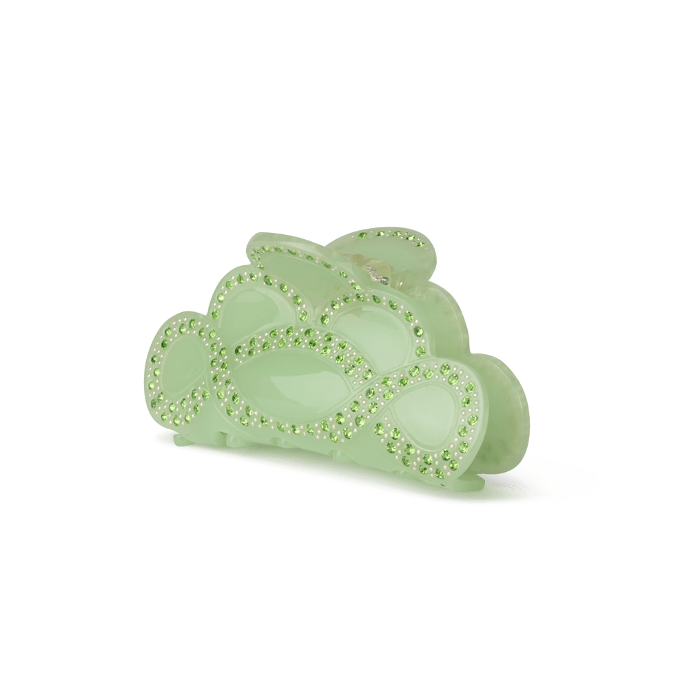 Liv Circular Middle hårklemme i lysegrøn med snoet, bølgende design og grønne krystaller.